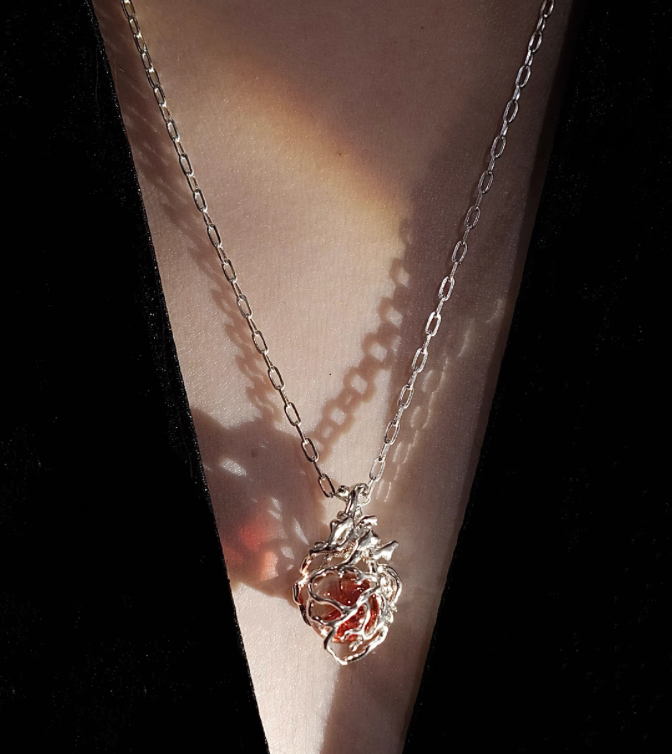 The "Caged Ember" Heart Pendant